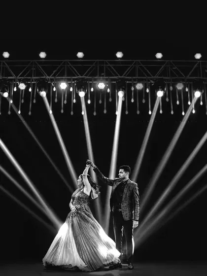 The spotlight finds the couple during their Sangeet. This dramatic, high-contrast shot showcases my love for creative lighting and capturing the energy of a performance, turning a dance into a timeless piece of art.