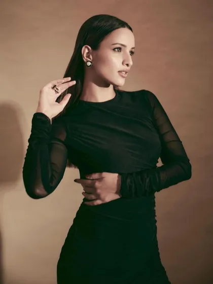 An all-black look is always a classic. I styled Tripti Dimri in this elegant ruched black dress with sheer sleeves, creating a sophisticated and versatile look suitable for many occasions.
