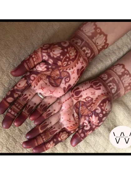 The beautiful dark stain of a peacock and elephant design, showing the final result.