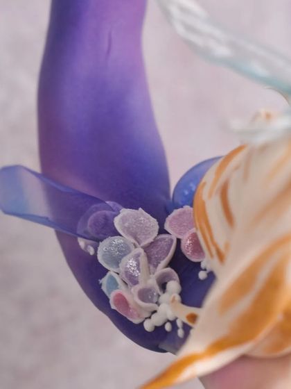 Detail shot of the mermaid's tail. I used wafer paper and hand-piped royal icing to create the delicate, translucent fins and floral embellishments.