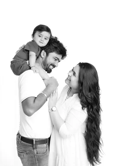 A black and white version of the family portrait, adding a timeless and classic quality to this beautiful moment.