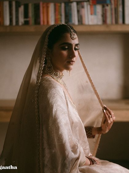 Another beautiful portrait of the bride, showcasing her serene beauty and the timeless elegance of her wedding look.