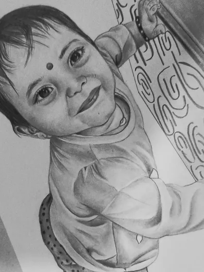 An angled view of the toddler sketch, showing the finished piece on my drawing pad.