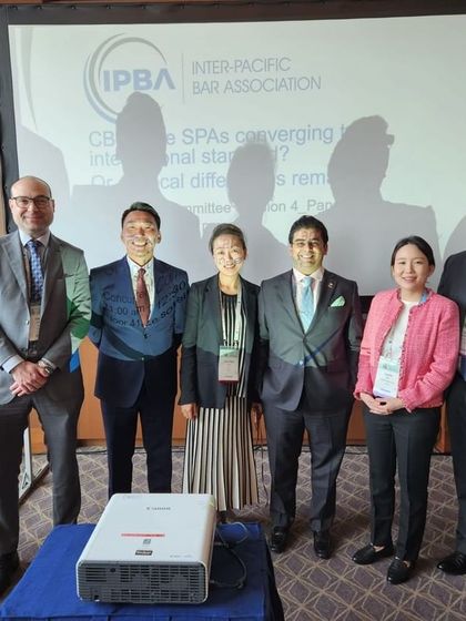 A group photo of the panelists from the session on cross-border M&A at the IPBA Conference in Tokyo.