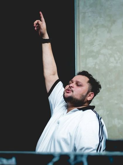 Pointing to the top, because that's the only direction we're headed. This shot captures my ambition and focus behind the decks.