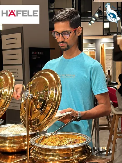 My goal is to make every guest's experience enjoyable. Here, a guest at a Häfele event helps himself to a warm dish from our polished brass chafing dishes, which not only look elegant but also maintain the perfect temperature for the food throughout the event.