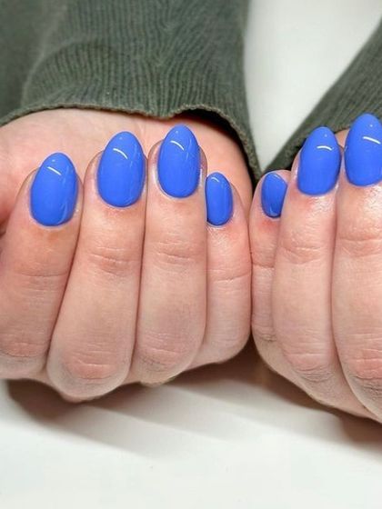 A vibrant cobalt blue manicure. This bold and beautiful color is perfect for someone who isn't afraid to stand out.