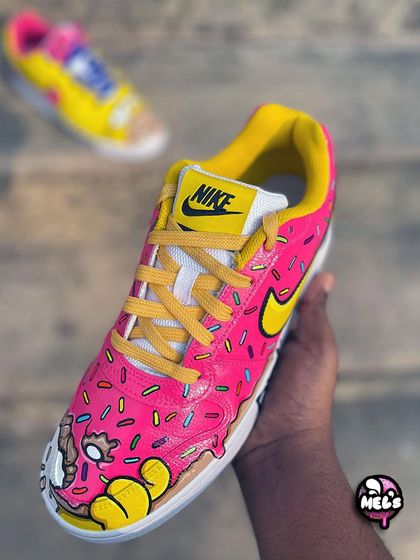 The other half of our Simpsons pair, this shoe is designed to look like Homer's favorite pink donut. It's covered in pink frosting and colorful sprinkles, with a dripping effect along the sole.