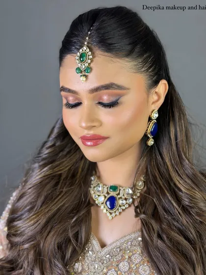 For my North Indian brides, I create looks that are both regal and modern. This style features soft, glamorous eyes, flawless skin, and a hairstyle that complements the intricate jewelry and outfit.