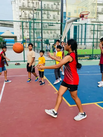 A female player practices her passing, a key component of our team-focused training.