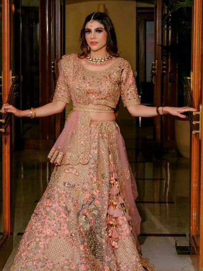 A powerful shot of a client looking radiant in a pre-loved designer lehenga. This is what it feels like to get your dream outfit without the guilt.