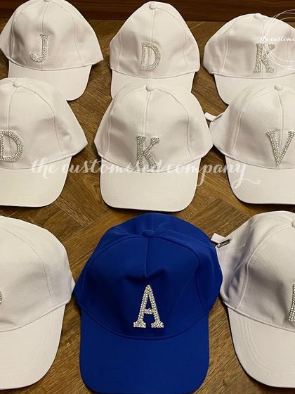 Add a little sparkle to your look with these custom caps featuring rhinestone initials. They are perfect for a bride-to-be, her bridal party, or anyone who loves to shine.
