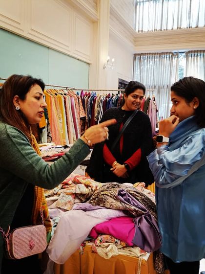 An animated discussion at a clothing stall. I love seeing vendors passionately share the story of their brand with customers.