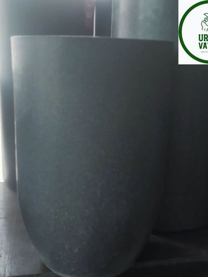 A dark grey, U-shaped fiber pot.