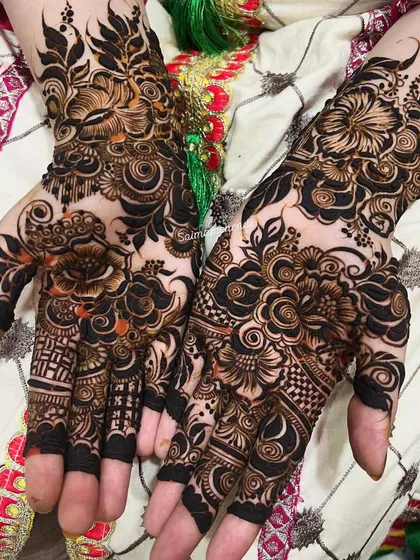 A perfect example of my intricate floral work with fresh, natural henna paste. The contrast is sharp and the lines are clean, showing the artistry before the beautiful stain even develops. This design features bold flowers with delicate fillings.