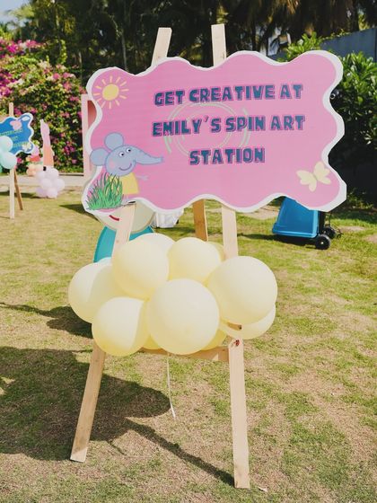 An easel sign for "Emily's Spin Art Station," another fun and creative activity planned for the party.