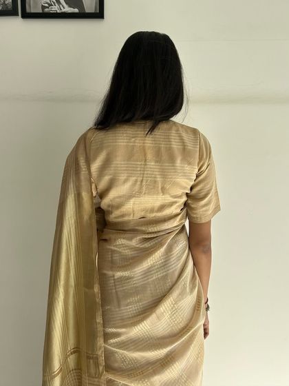 The back view of our Karghewale saree, showcasing its beautiful drape and the subtle sheen of the silk and zari blend.