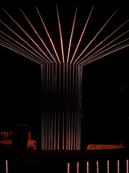A panoramic view of the stunning LED bar and chandelier setup, creating a high-impact, low-light ambiance for a memorable cocktail night.