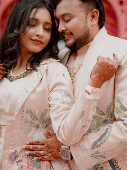 A close-up, intimate portrait of the couple, capturing the fine details of their Sangeet outfits.