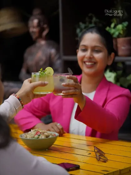 Cheers to teamwork and summer drinks. A regular customer and her colleague celebrate a successful project with some of our refreshing new beverages.