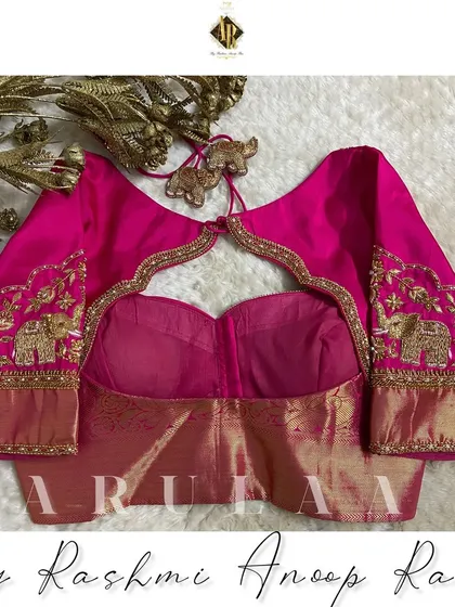 The back view of the elephant motif blouse, showing a beautiful keyhole cutout framed with detailed zardosi work. It’s all about creating a complete, 360-degree design.