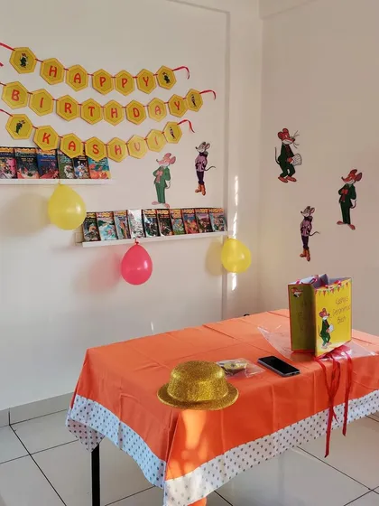 Themed decorations make a party so much more fun! This setup was for a book-loving birthday girl who adores Geronimo Stilton.