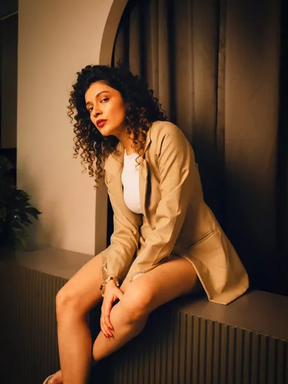 A relaxed and confident pose on a ledge. This shows how we can use the architecture of a space to create interesting compositions.