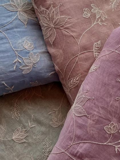 An assortment of our embroidered Mul Chanderi fabrics in beautiful pastel shades. The tone-on-tone floral embroidery is a signature of understated elegance.