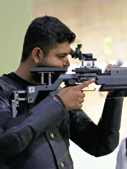 The calm and steady posture of a rifleman using his Anschutz rifle. I handle all the background logistics so that every shooter, from novice to pro, can enter this state of flow and focus only on their target.