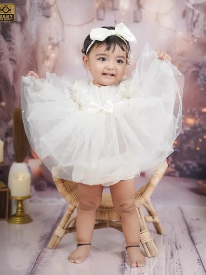 Showing off her beautiful dress. This pose is perfect for highlighting the details of a special outfit.