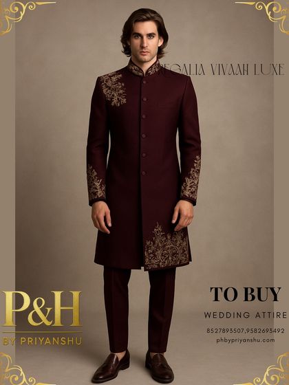 This wine-colored Indo-Western suit offers a rich and luxurious alternative for wedding events. The asymmetrical golden hand-embroidery adds a touch of modern artistry to the classic long-jacket silhouette.