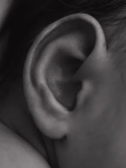 The perfect swirl of a tiny ear. I love capturing these small, intricate details in black and white to create timeless, artistic portraits.
