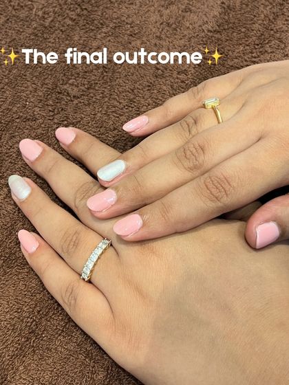 The final outcome! A beautiful, clean set of nails with a soft pink base and a chic white accent nail.