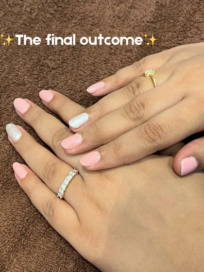 The final outcome! A beautiful, clean set of nails with a soft pink base and a chic white accent nail.