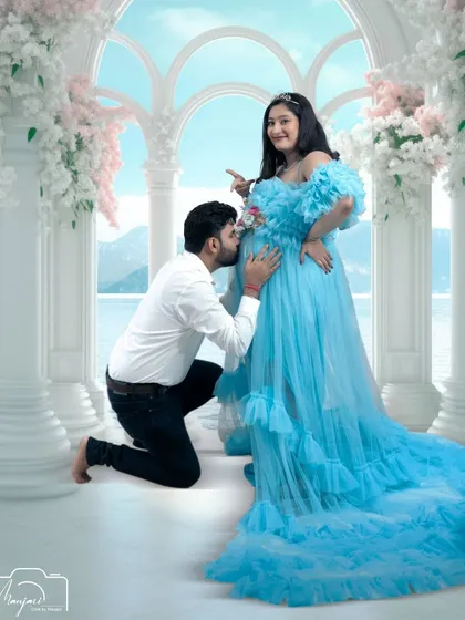 A fun and playful moment as the dad-to-be kisses the bump. The AI-enhanced background of a seaside palace adds a touch of whimsy and grandeur.