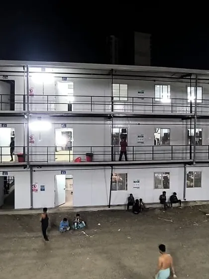 This wide-angle night shot captures the full expanse of the prefabricated labor colony in Mumbai. The project demonstrates our expertise in delivering large-scale, functional housing solutions quickly.