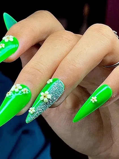 A stunning neon green set with 3D white flowers and a sparkling sugar glitter accent nail.