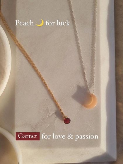 A beautiful pairing of intentions. This image shows my Garnet heart drop pendant for love and passion, alongside the Peach Moonstone luna pendant, which I create for luck and new beginnings.