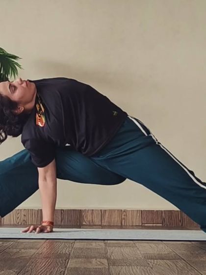 This is an advanced twisting and balancing pose that deeply stretches the side body, hamstrings, and hips. It's a complex asana that demonstrates a high level of flexibility.