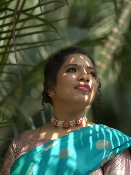 An artistic shot with shadows playing on the bride's face, highlighting her beautiful features and makeup.