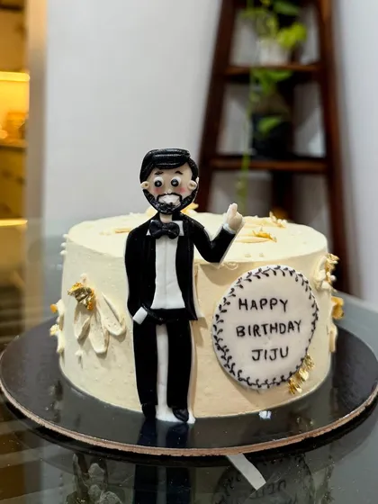 A special birthday cake for a special jiju. I created a custom fondant figurine to match his style, complete with a tuxedo. It's a fun way to add a personal touch to the celebration.
