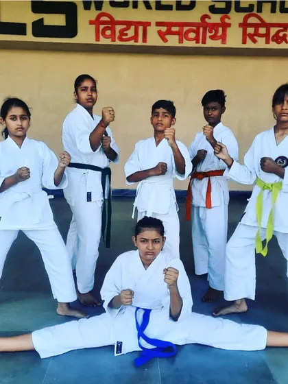 Our students showing their strength and flexibility. The girl in front demonstrates a full split, a testament to her dedication.