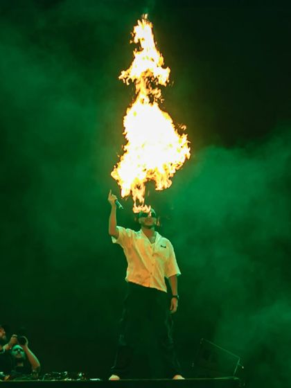 DJ Snake turns up the heat, literally, with a fire-breathing effect during his high-octane performance.