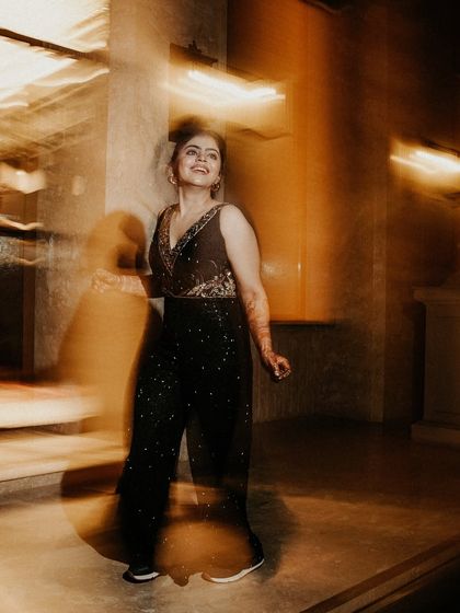 Capturing the spirit of the dance. This motion blur shot highlights the bride's happy expression while the swirling lights and movement create a vibrant, energetic feel.