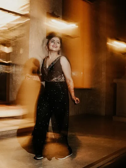 Capturing the spirit of the dance. This motion blur shot highlights the bride's happy expression while the swirling lights and movement create a vibrant, energetic feel.