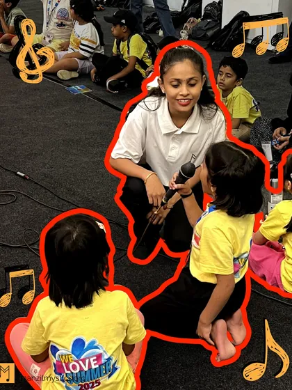 A young girl gets her first chance to sing into a microphone during our summer camp. These moments are magical, sparking a child's dream of becoming a performer.