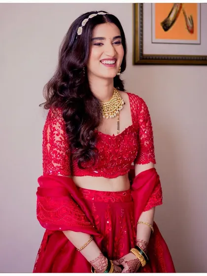 Two completely different looks for Aditi's wedding and reception. This shows the transformation from a traditional saree look to a modern lehenga look with a quick touch-up.