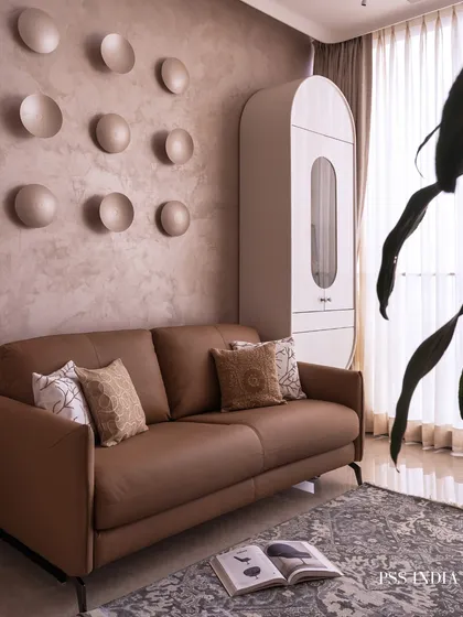 This wider shot of the guest room shows the full context, including the unique pill-shaped white cabinet and the soft light filtering through the curtains, creating a calm and welcoming space for visitors.