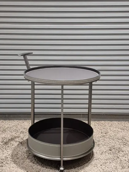 This two-tiered bar cart or serving trolley in grey and chrome is a stylish and mobile addition to any living or dining area.
