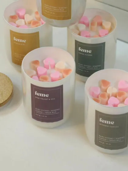 A group of our Holographic Jars, each filled with our signature soy wax and topped with adorable heart melts.